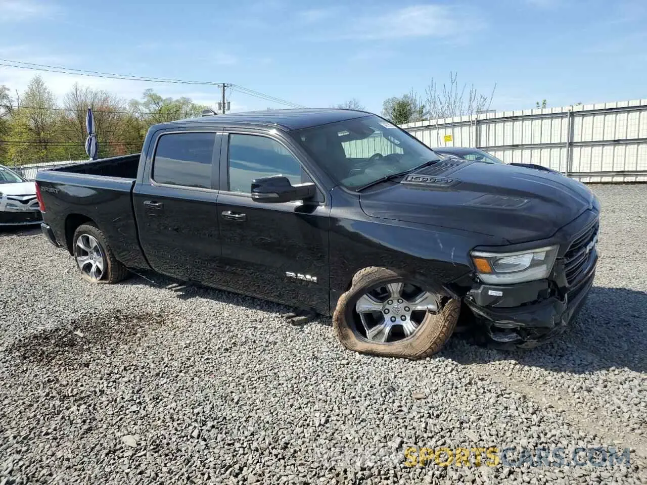 4 Photograph of a damaged car 1C6SRFRT5PN522190 RAM 1500 2023