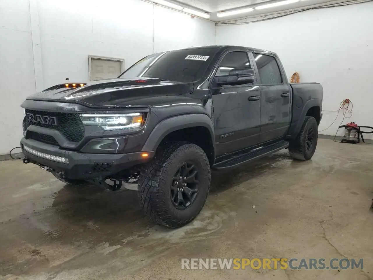 1 Photograph of a damaged car 1C6SRFU93PN551408 RAM 1500 2023