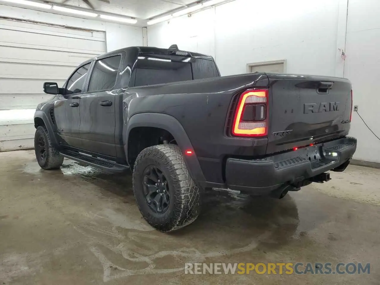 2 Photograph of a damaged car 1C6SRFU93PN551408 RAM 1500 2023