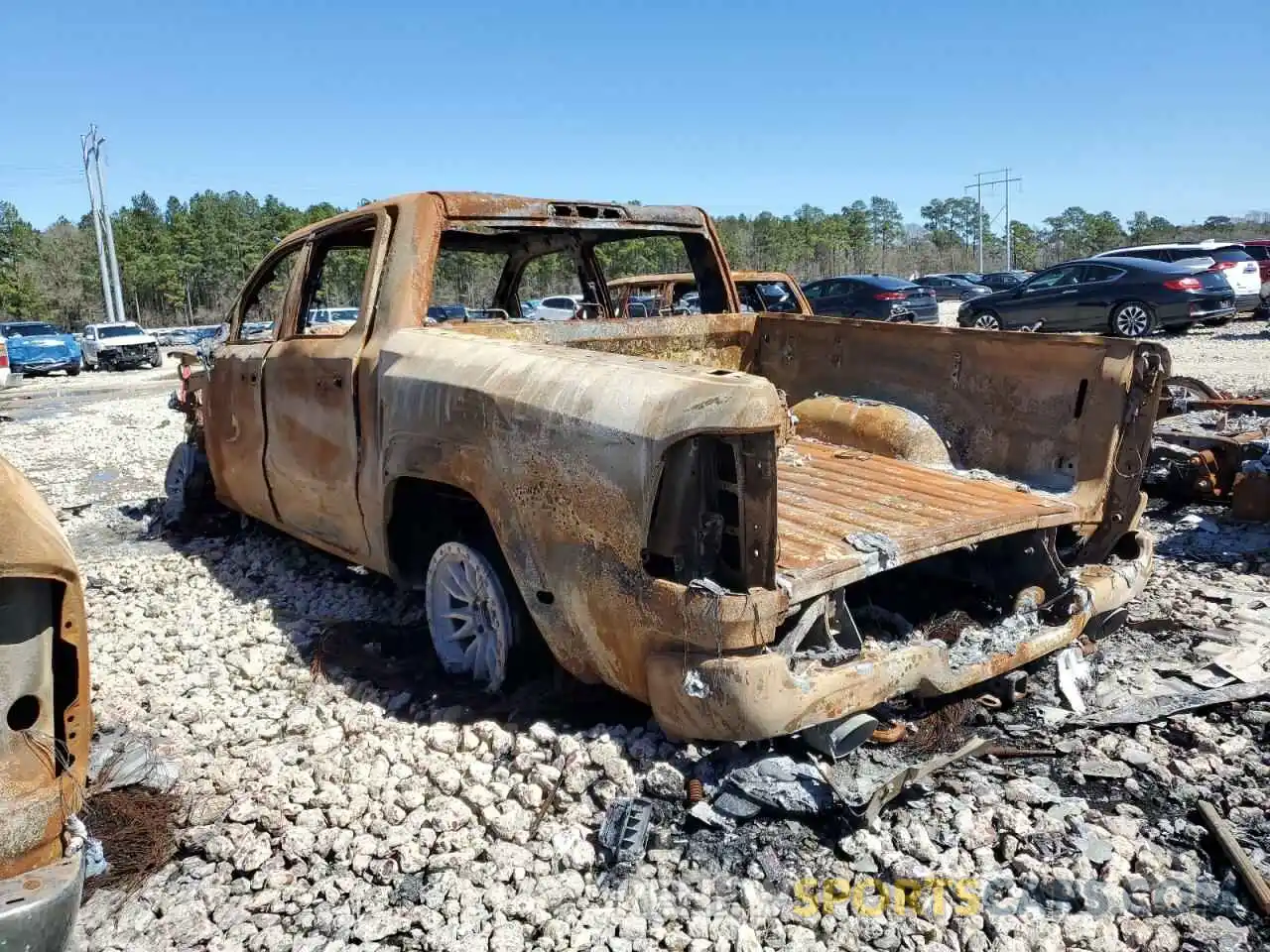 2 Photograph of a damaged car 1C6SRFU93PN572663 RAM 1500 2023