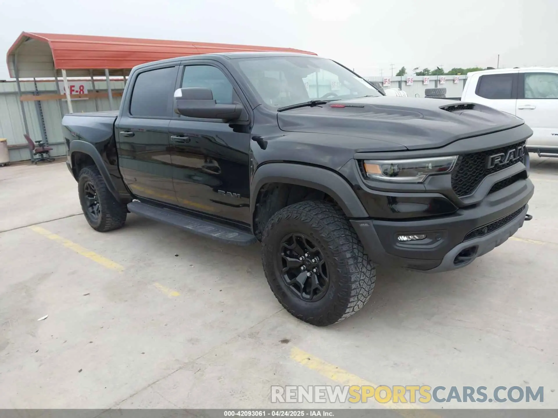 1 Photograph of a damaged car 1C6SRFU93PN572940 RAM 1500 2023