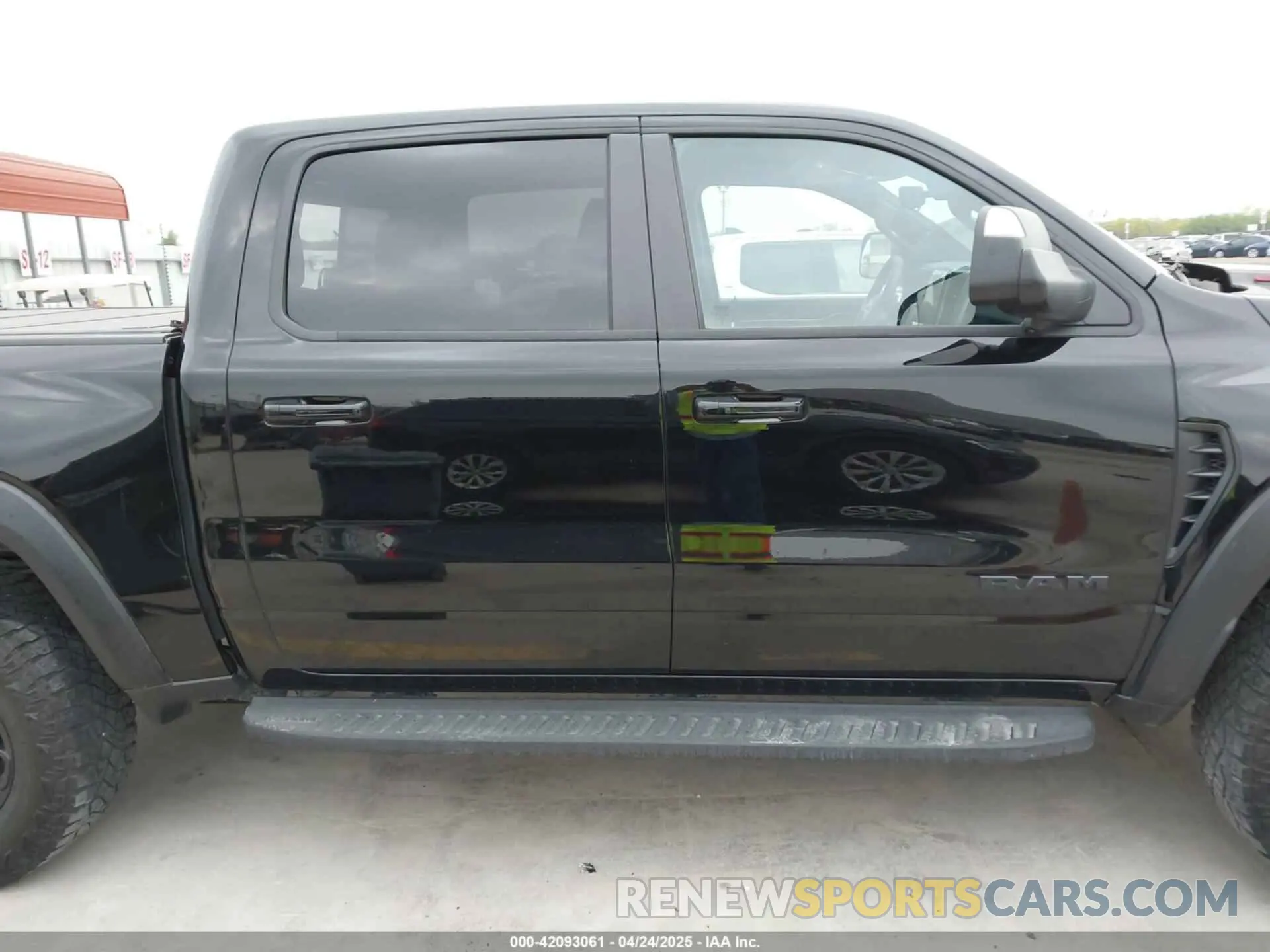 13 Photograph of a damaged car 1C6SRFU93PN572940 RAM 1500 2023