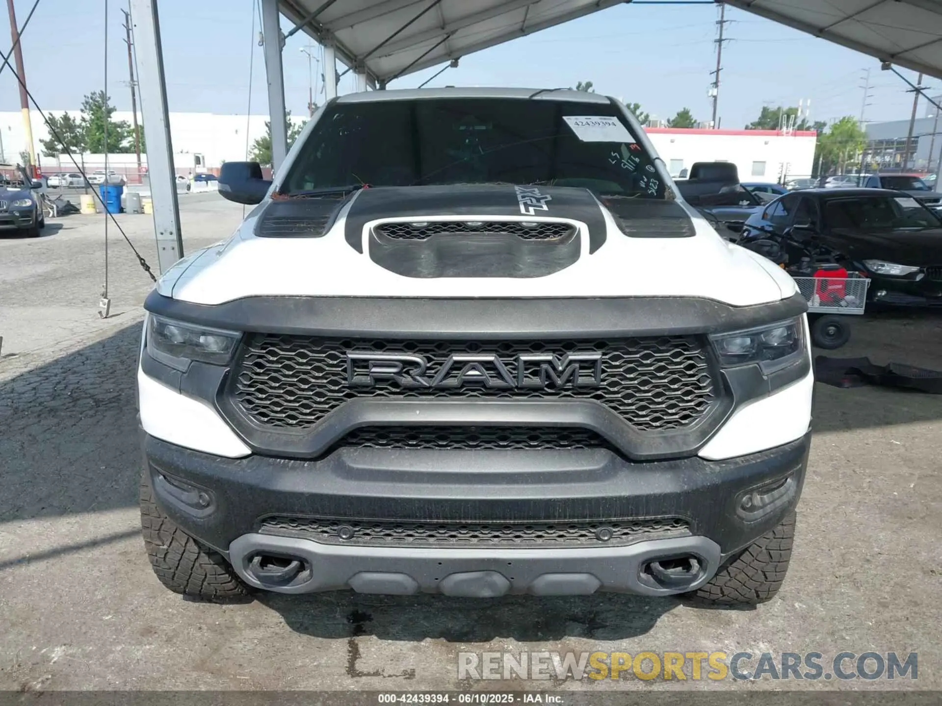 12 Photograph of a damaged car 1C6SRFU93PN585123 RAM 1500 2023