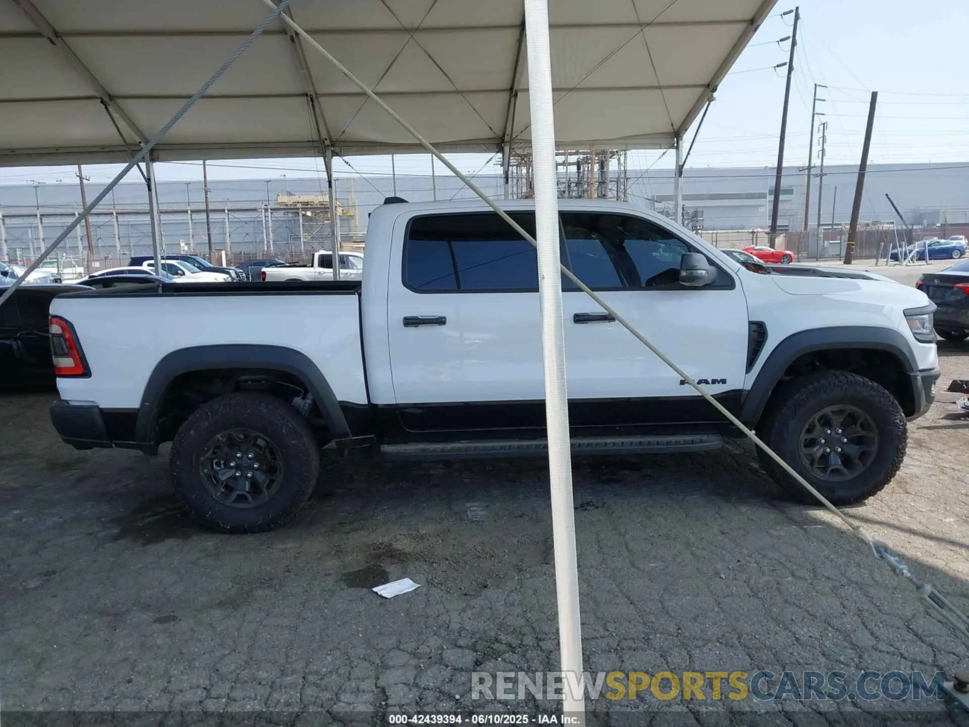 13 Photograph of a damaged car 1C6SRFU93PN585123 RAM 1500 2023