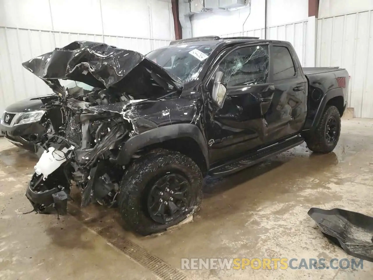 1 Photograph of a damaged car 1C6SRFU98PN511499 RAM 1500 2023