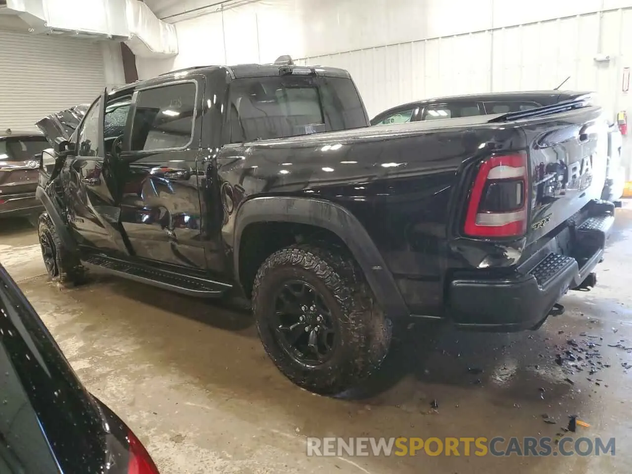 2 Photograph of a damaged car 1C6SRFU98PN511499 RAM 1500 2023