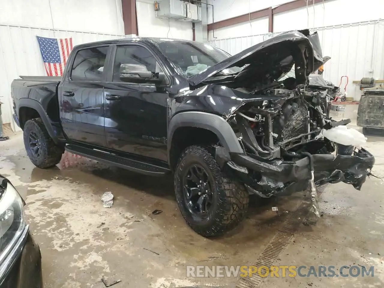 4 Photograph of a damaged car 1C6SRFU98PN511499 RAM 1500 2023