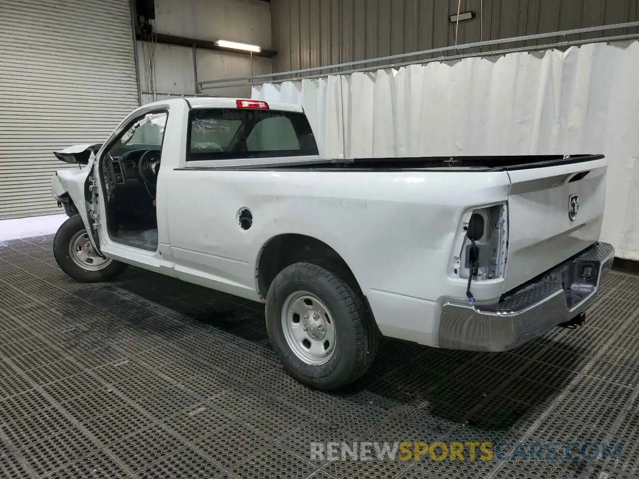 2 Photograph of a damaged car 3C6JR6DG0PG550543 RAM 1500 2023