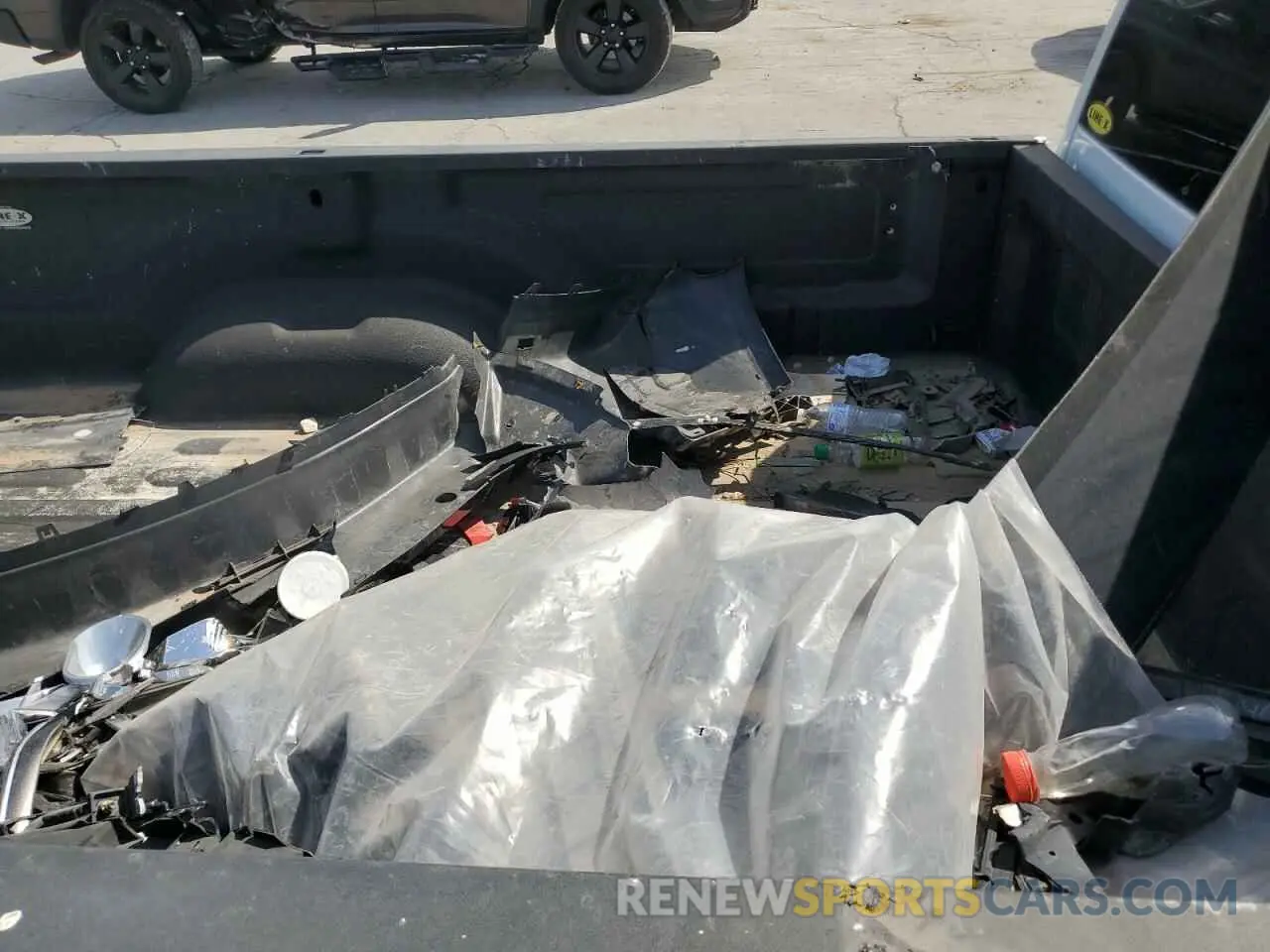 13 Photograph of a damaged car 3C6JR6DT0PG674339 RAM 1500 2023