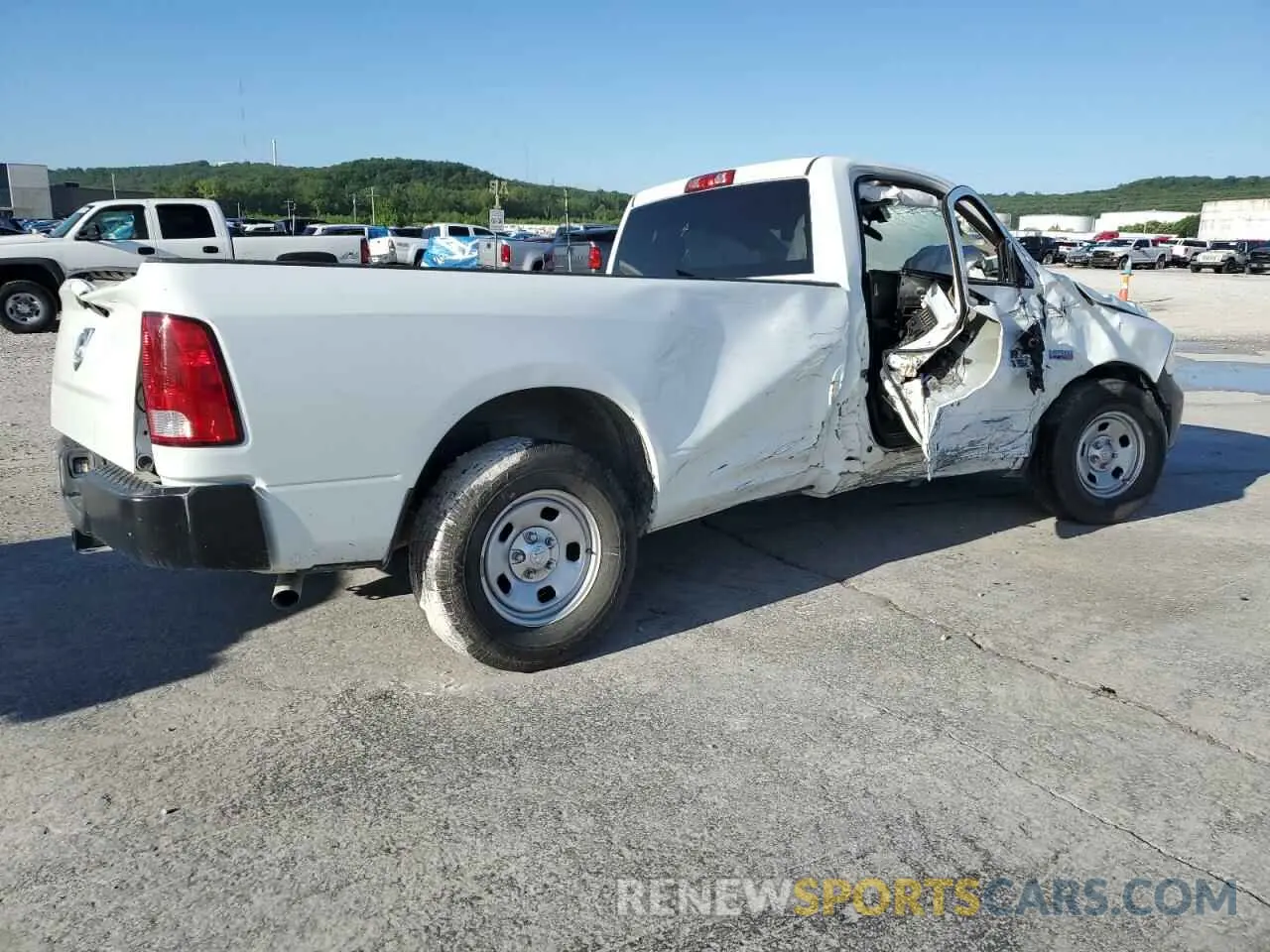 3 Photograph of a damaged car 3C6JR6DT0PG674339 RAM 1500 2023