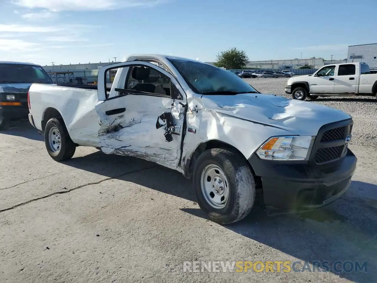 4 Photograph of a damaged car 3C6JR6DT0PG674339 RAM 1500 2023