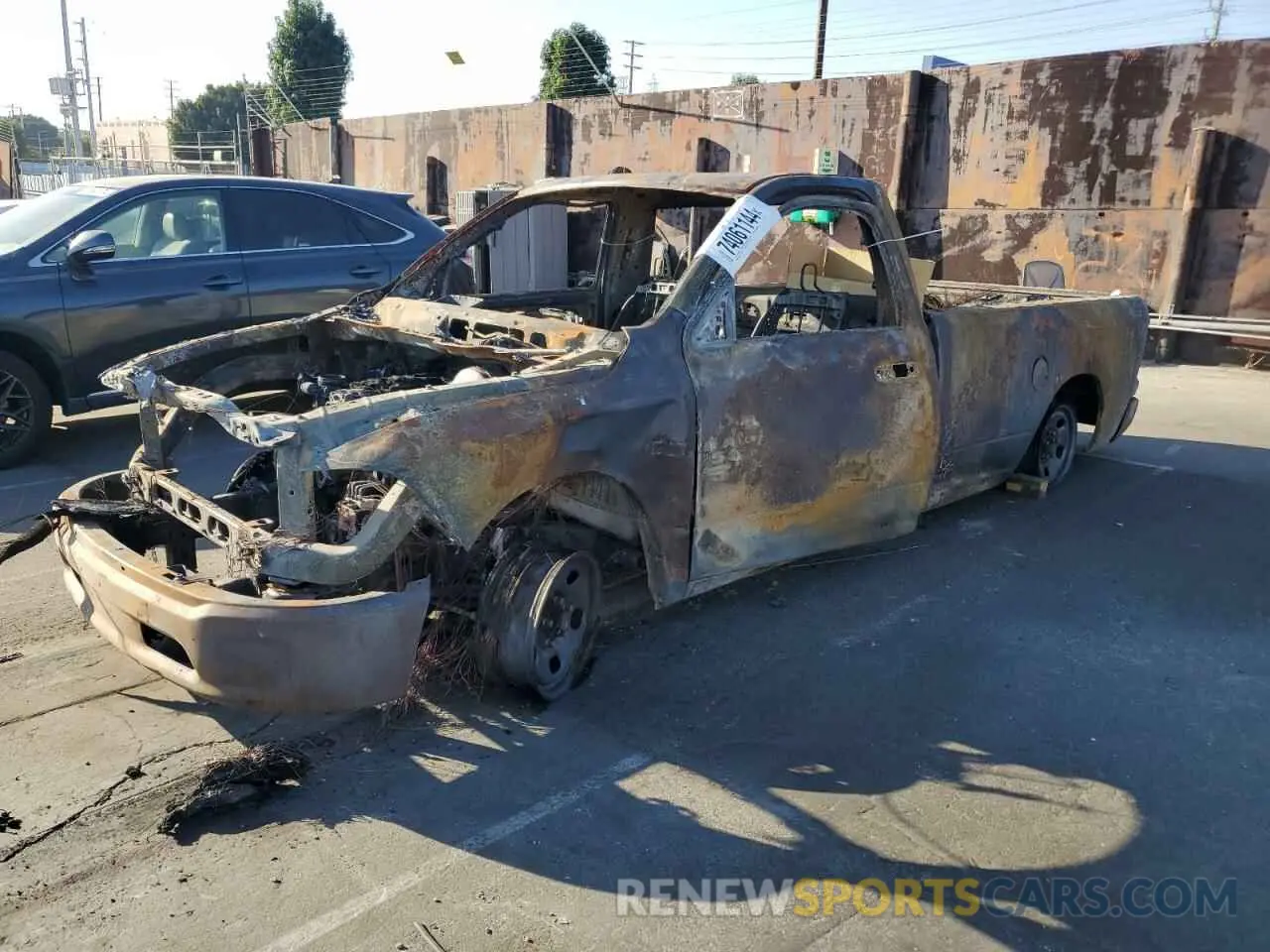 1 Photograph of a damaged car 3C6JR6DTXPG542964 RAM 1500 2023