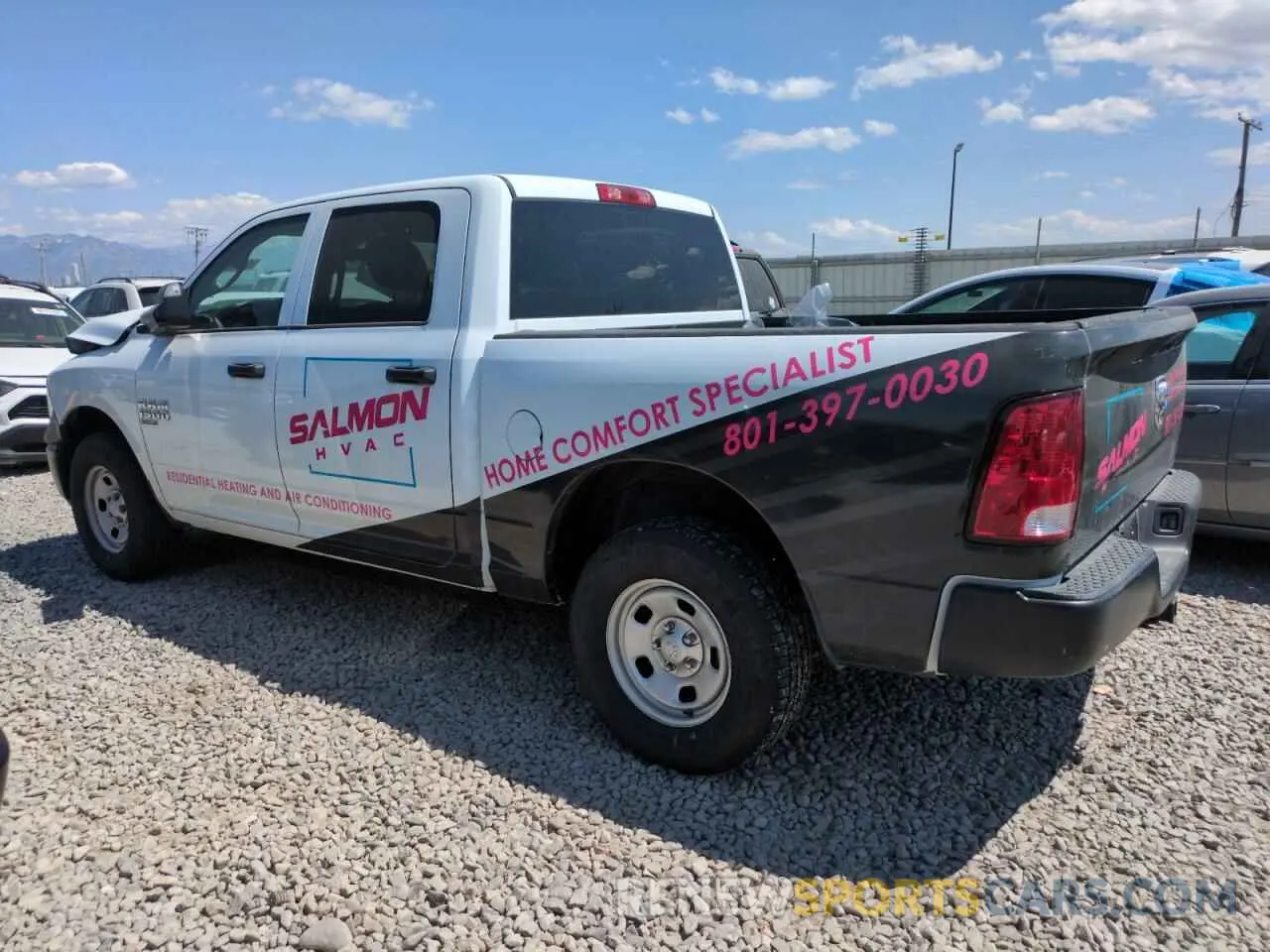 2 Photograph of a damaged car 3C6RR7KG5PG675808 RAM 1500 2023