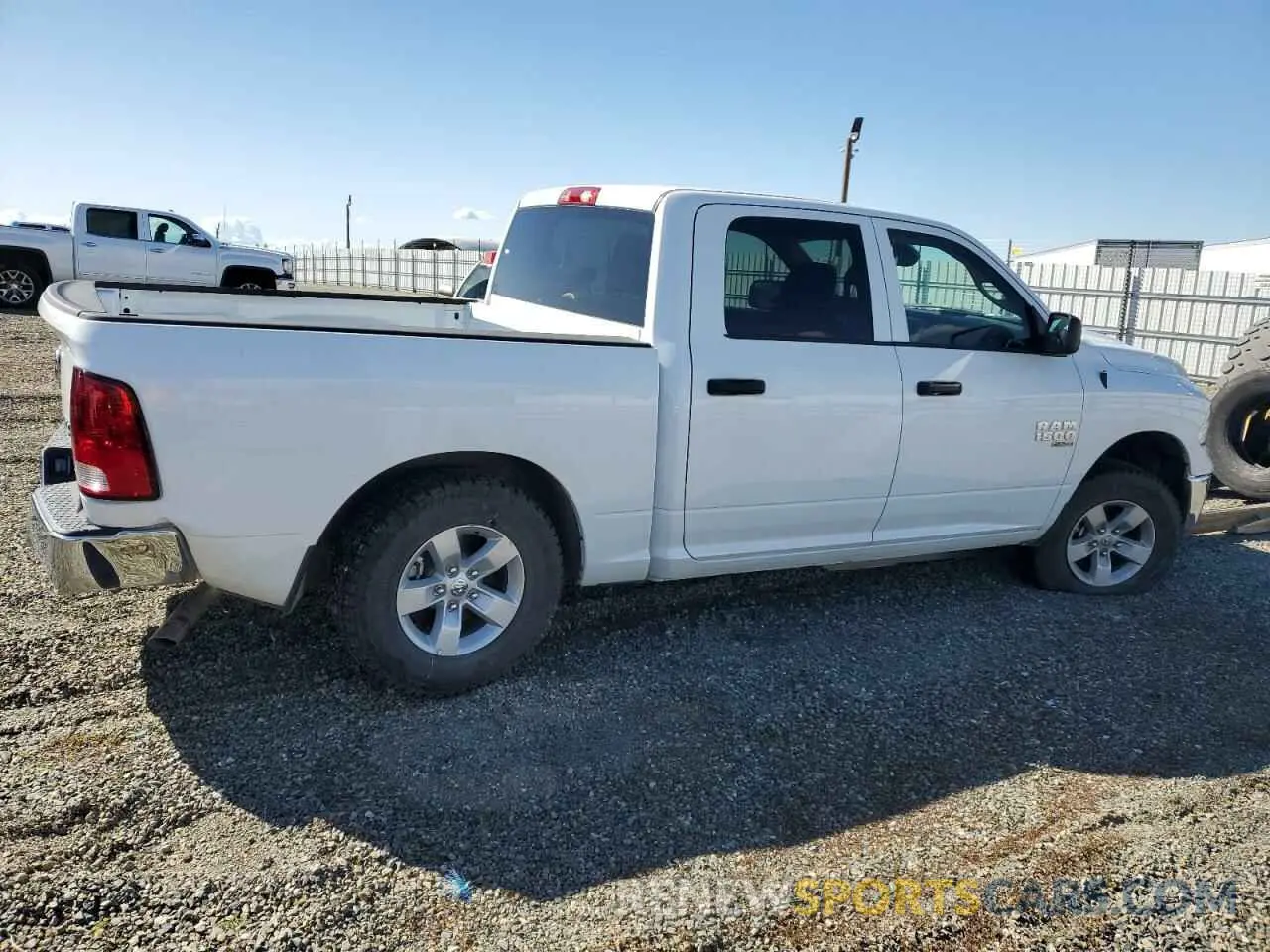 3 Photograph of a damaged car 3C6RR7LG8PG661075 RAM 1500 2023