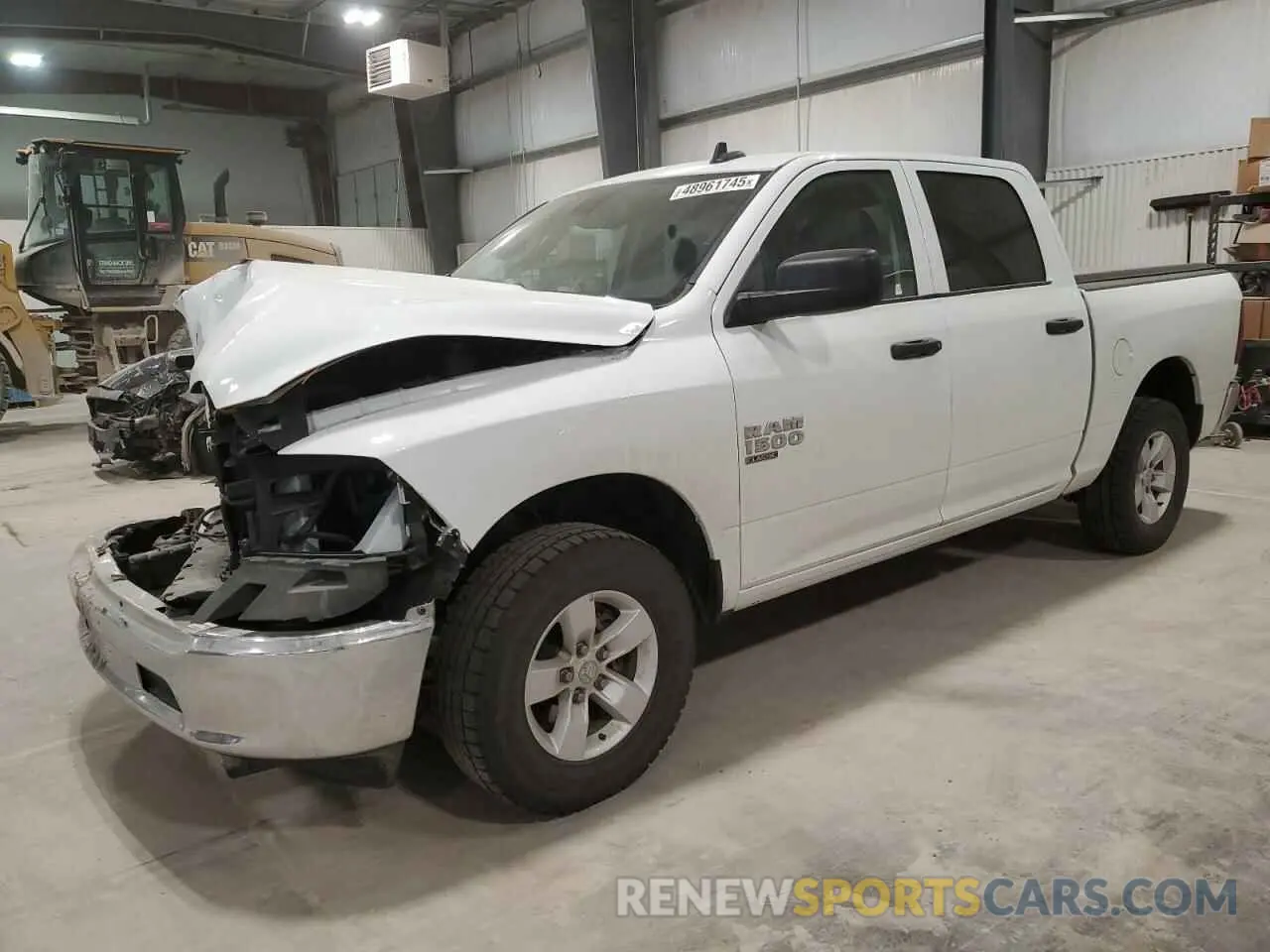1 Photograph of a damaged car 3C6RR7LG9PG661425 RAM 1500 2023
