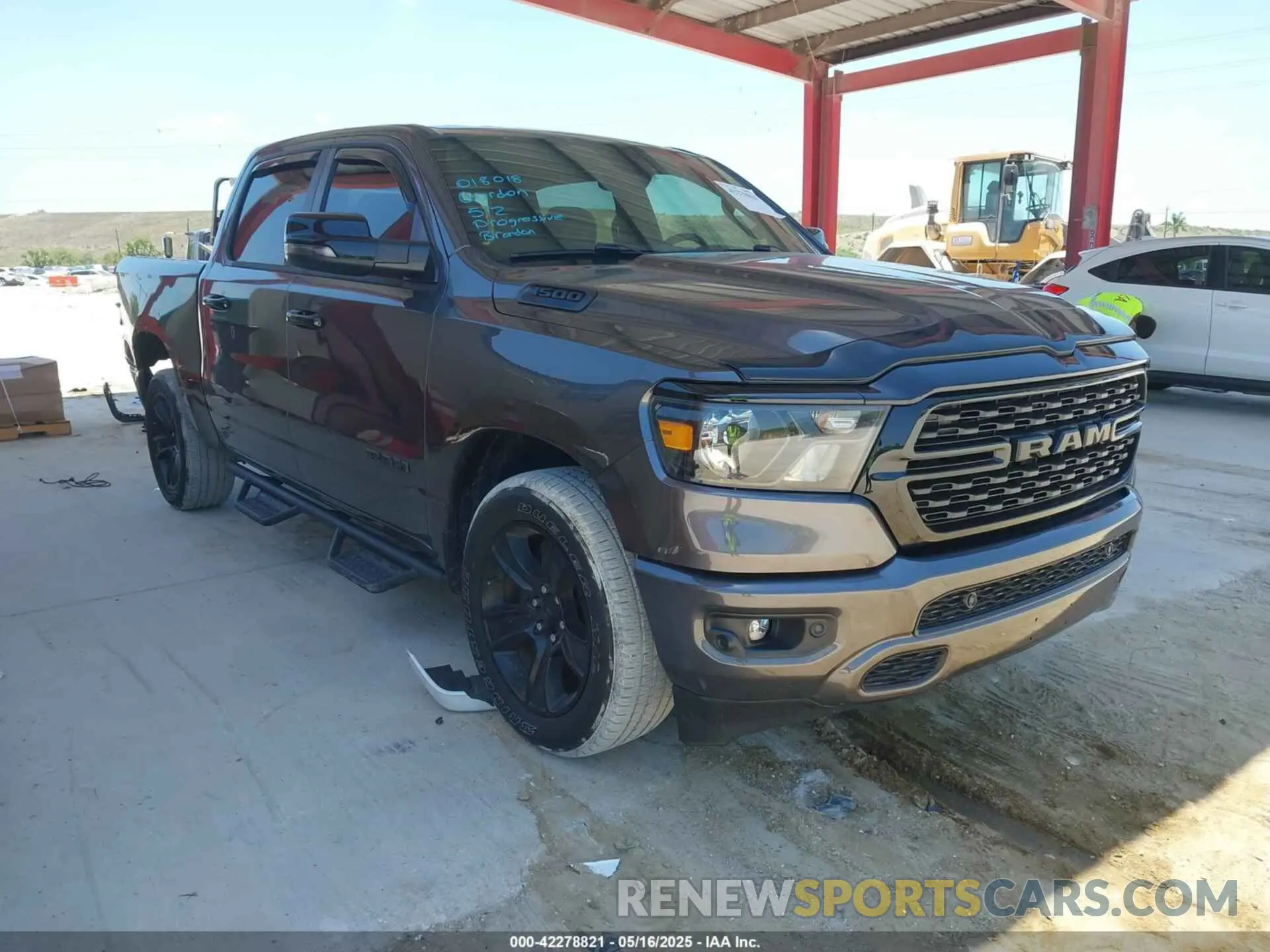 1 Photograph of a damaged car 1C6RREFT2RN134303 RAM 1500 2024