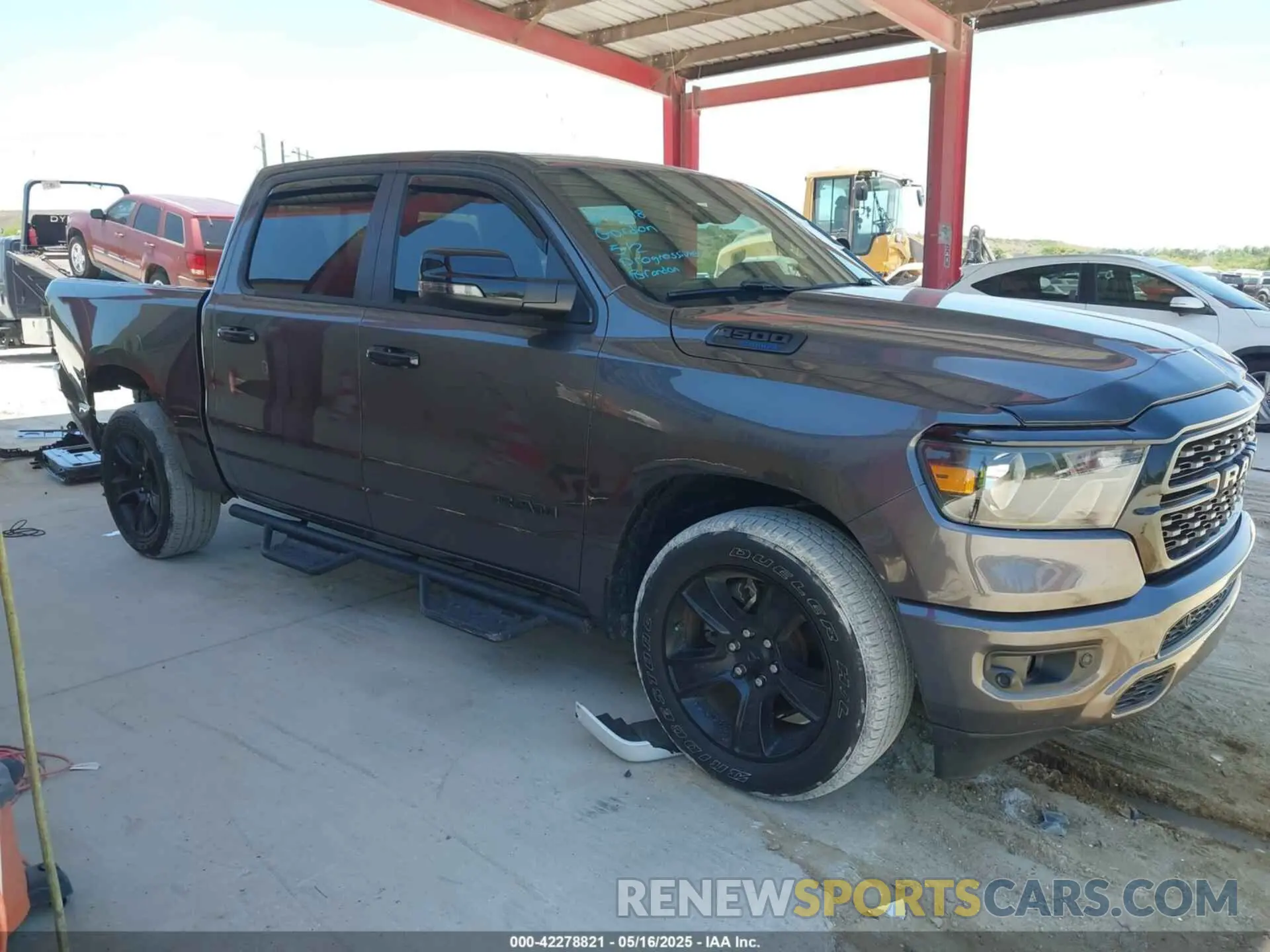 14 Photograph of a damaged car 1C6RREFT2RN134303 RAM 1500 2024
