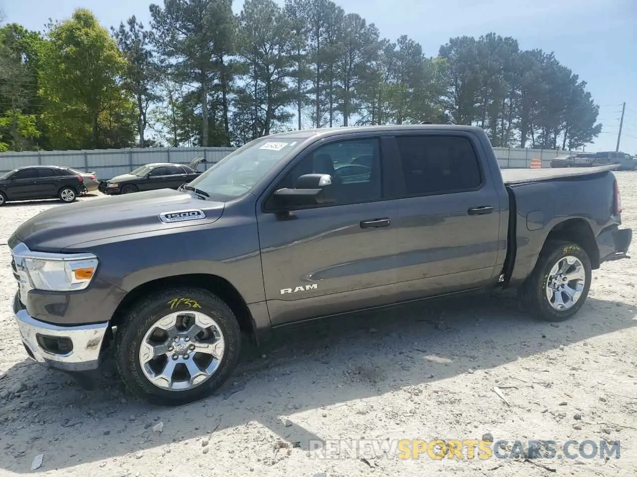 1 Photograph of a damaged car 1C6RREFT7RN111924 RAM 1500 2024