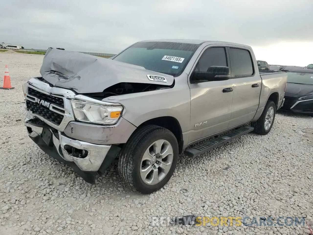1 Photograph of a damaged car 1C6RRFFG4RN209592 RAM 1500 2024