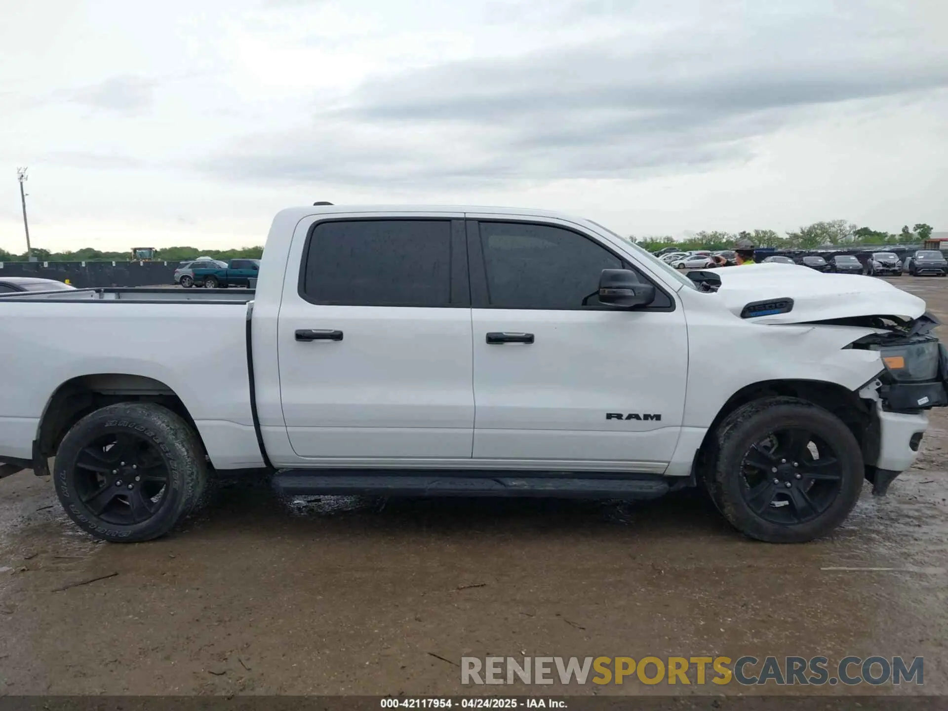 13 Photograph of a damaged car 1C6RRFFG6RN230332 RAM 1500 2024