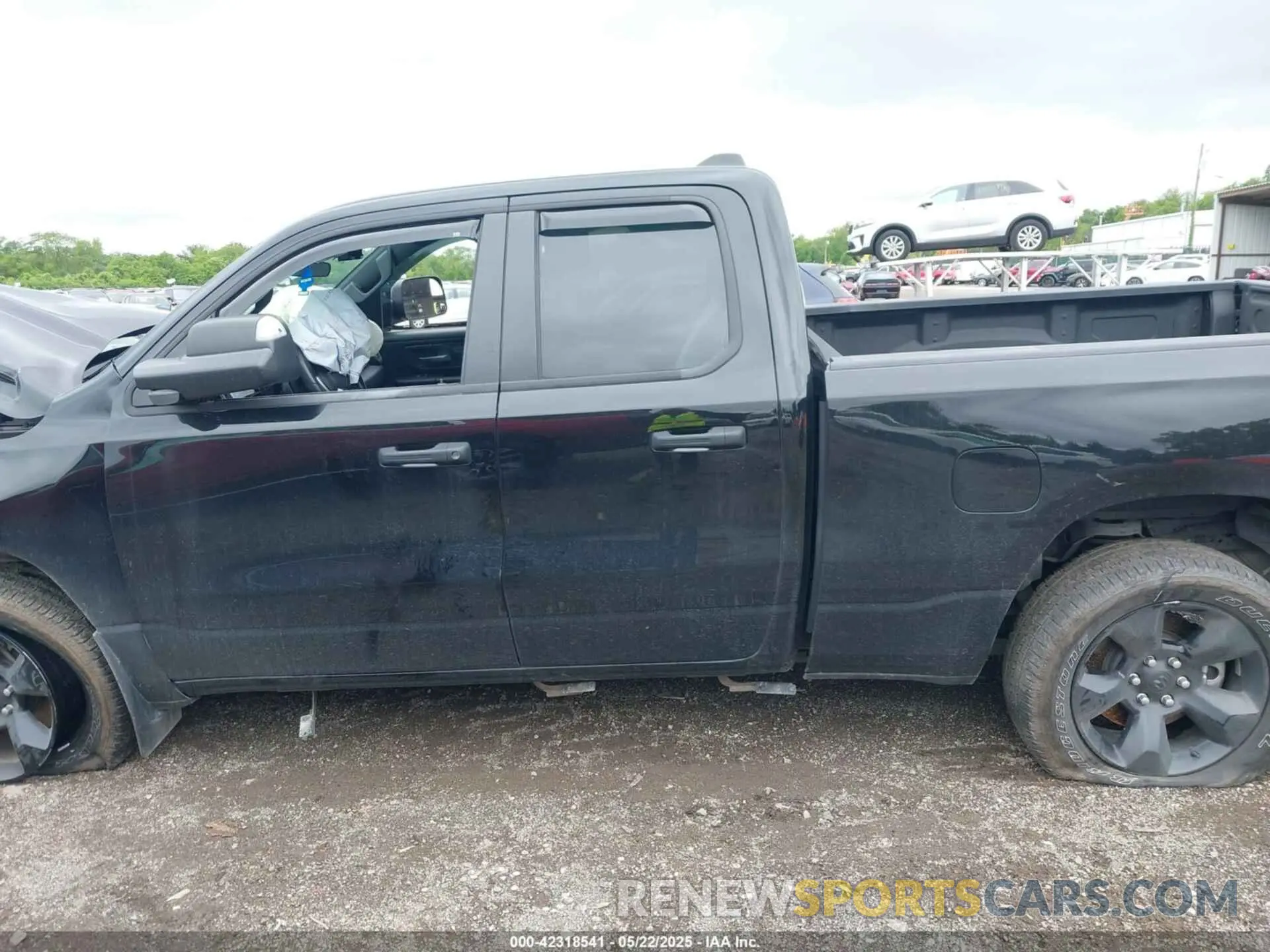 14 Photograph of a damaged car 1C6SRFCT2RN138329 RAM 1500 2024