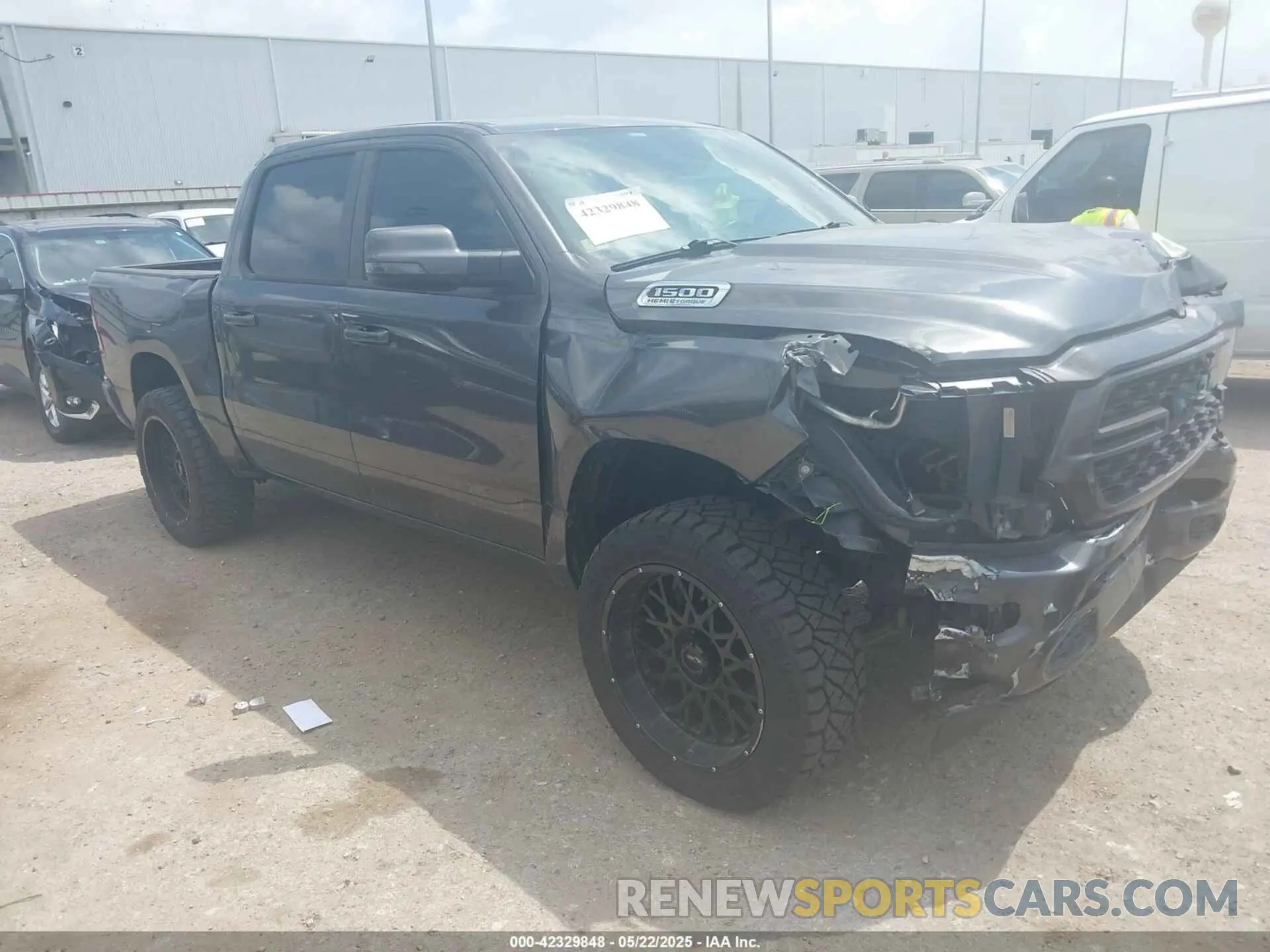 1 Photograph of a damaged car 1C6SRFFT5RN184572 RAM 1500 2024