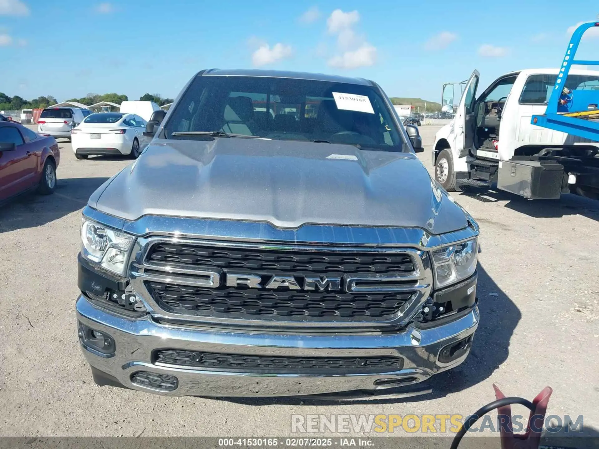 13 Photograph of a damaged car 1C6SRFMT5RN160517 RAM 1500 2024