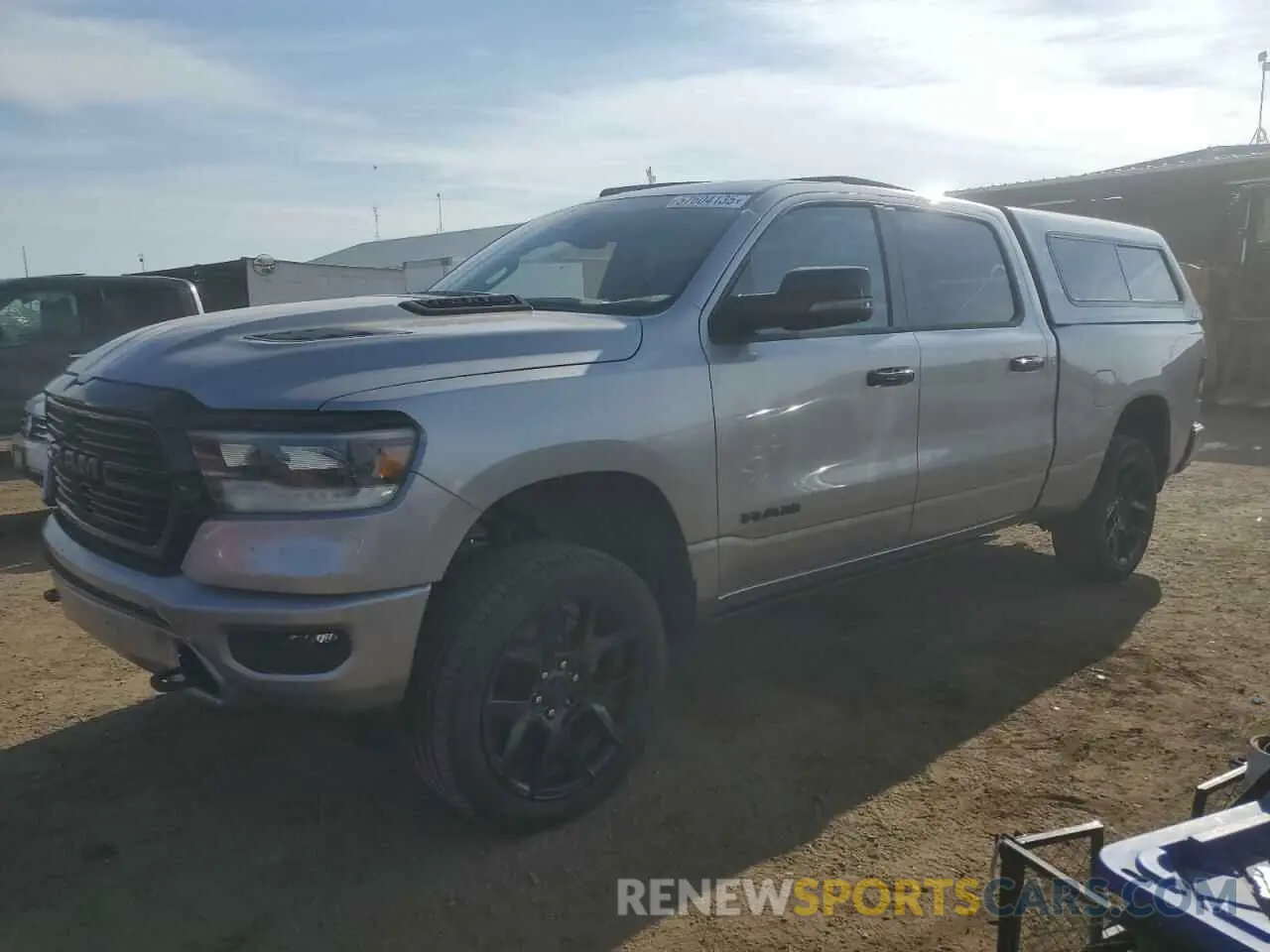 1 Photograph of a damaged car 1C6SRFRT5RN107891 RAM 1500 2024