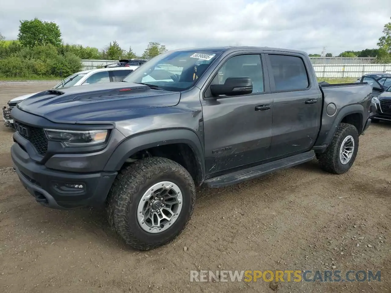 1 Photograph of a damaged car 1C6SRFU91RN141399 RAM 1500 2024