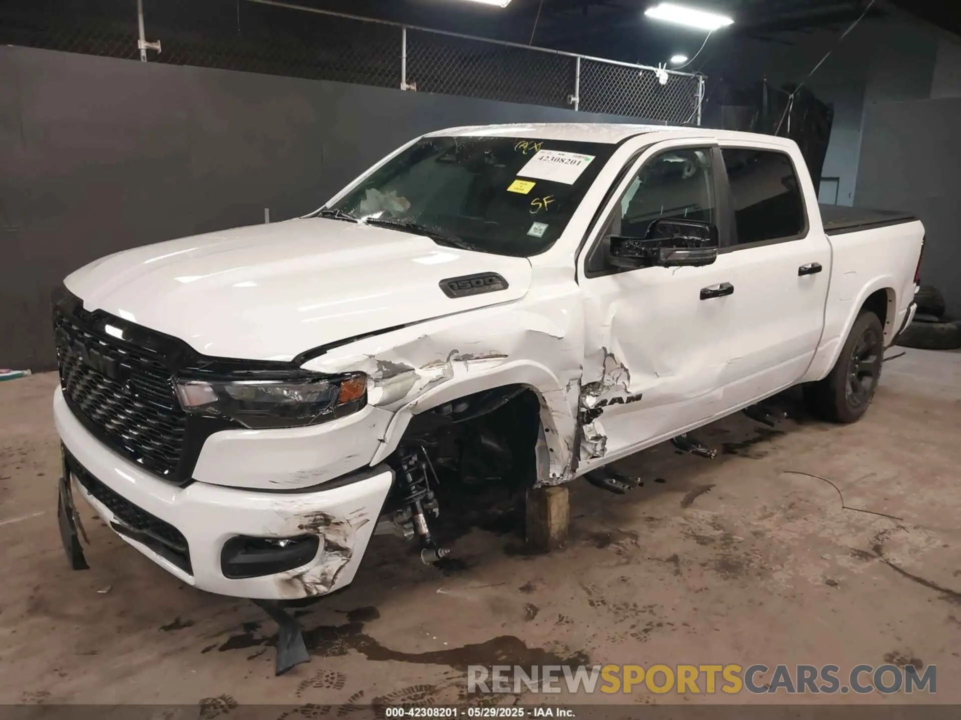 2 Photograph of a damaged car 1C6SRFFP9SN703082 RAM 1500 2025