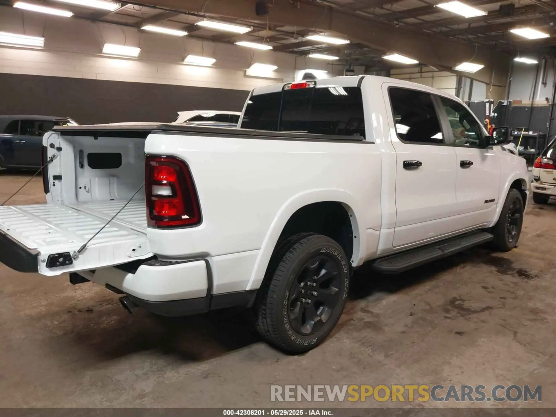 4 Photograph of a damaged car 1C6SRFFP9SN703082 RAM 1500 2025