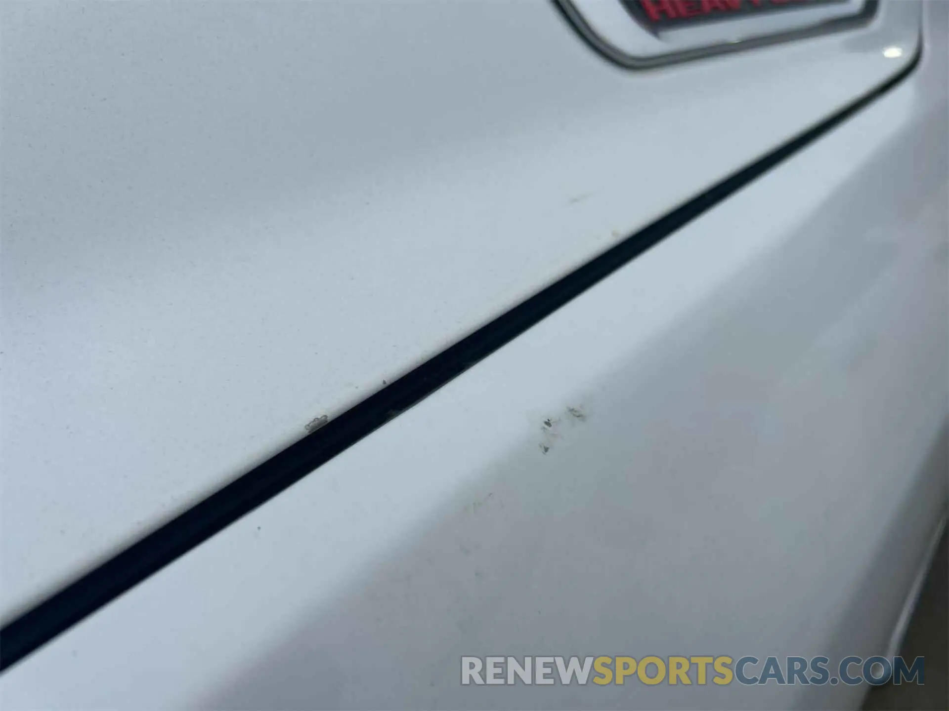 13 Photograph of a damaged car 3C6UR5CL4KG598108 RAM 2500 2019