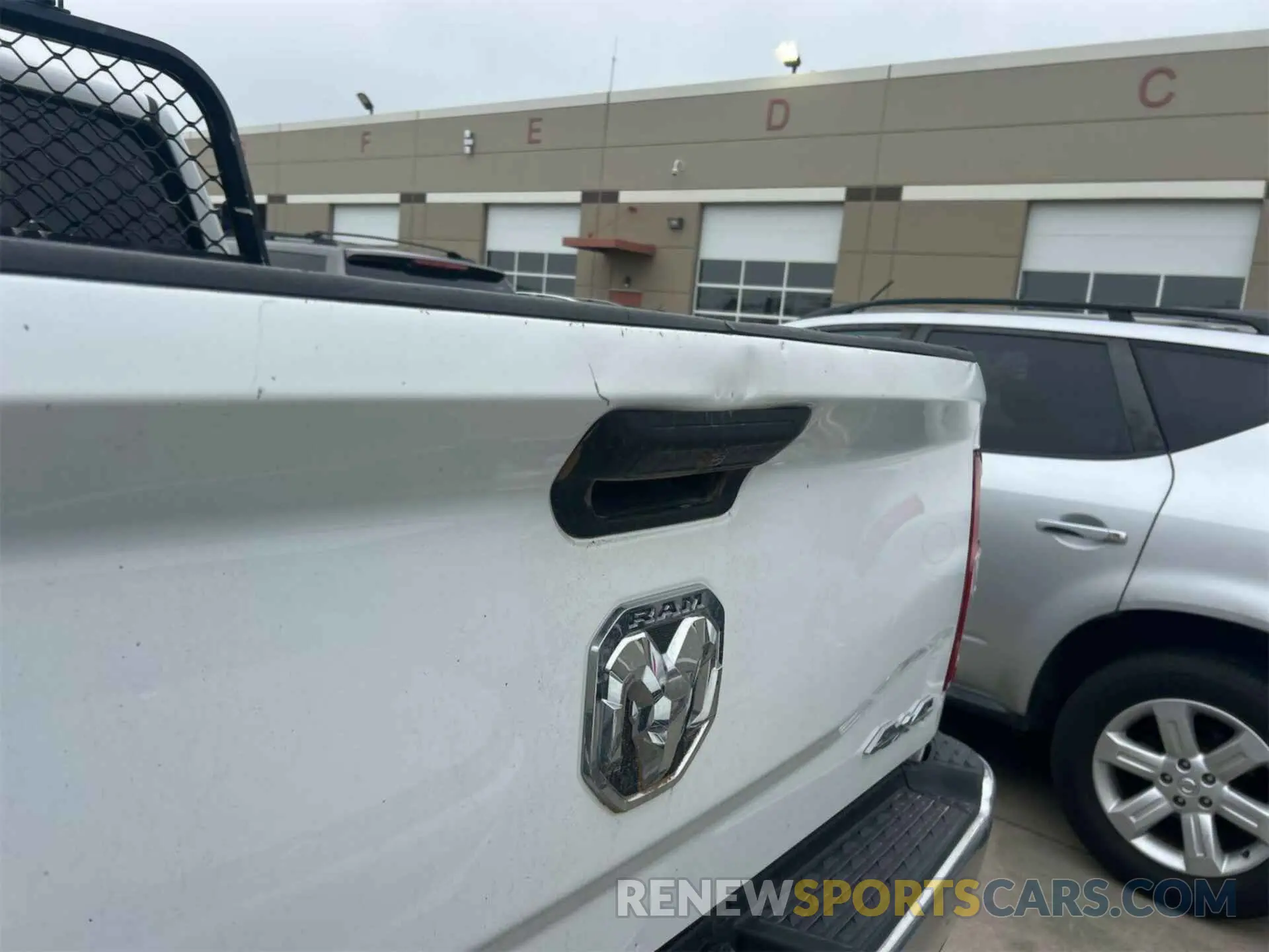 7 Photograph of a damaged car 3C6UR5CL4KG598108 RAM 2500 2019