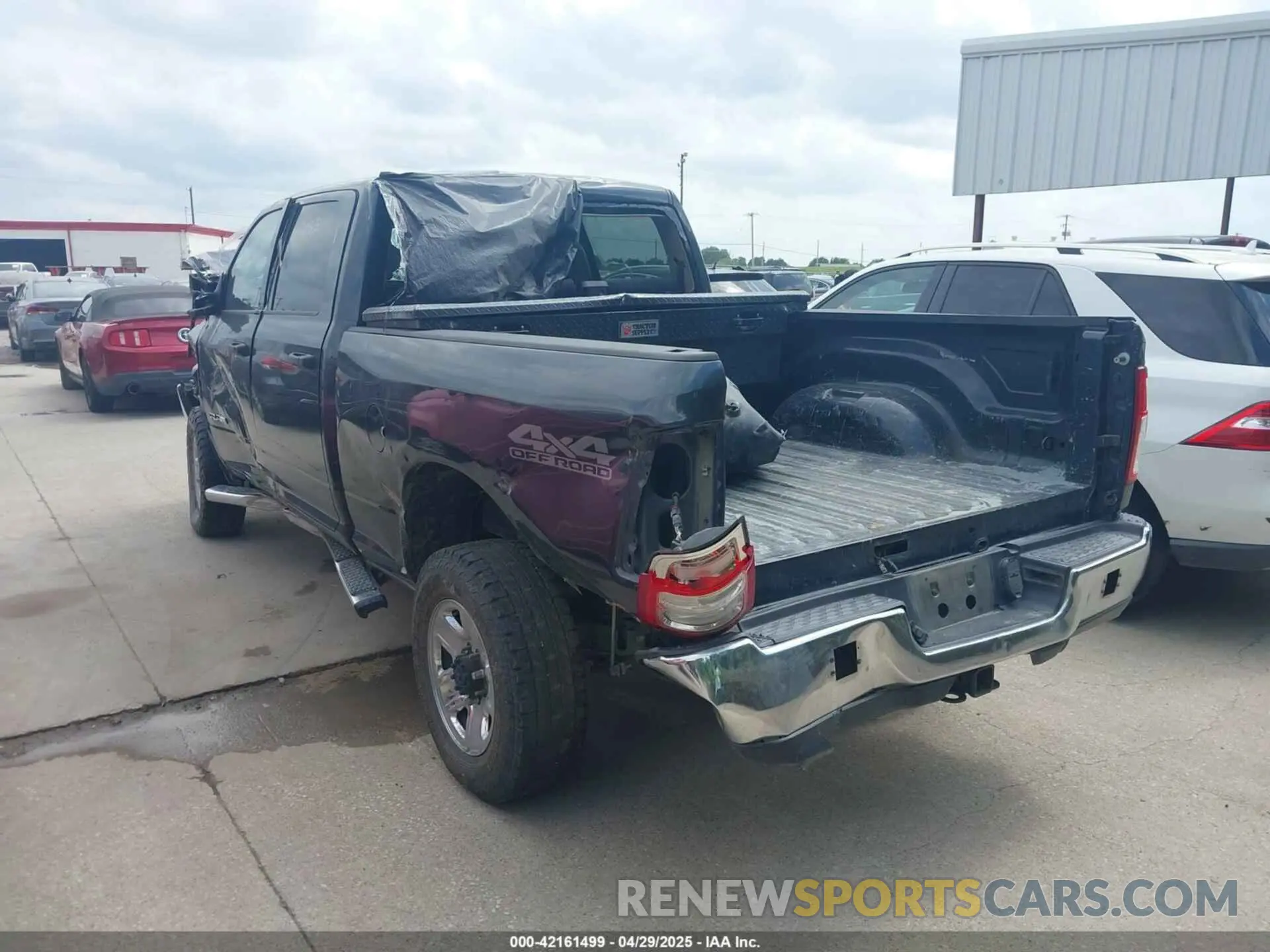 3 Photograph of a damaged car 3C6UR5CL9KG706769 RAM 2500 2019