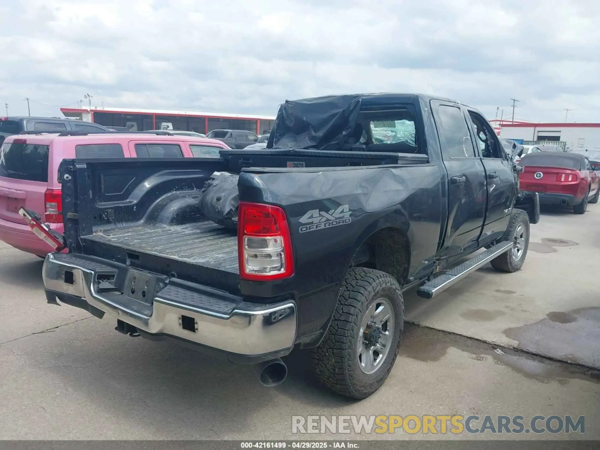 4 Photograph of a damaged car 3C6UR5CL9KG706769 RAM 2500 2019