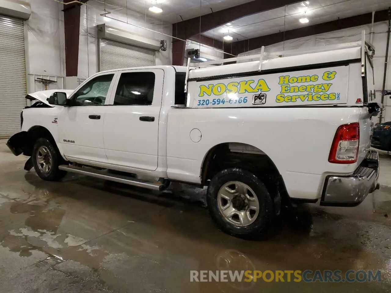 2 Photograph of a damaged car 3C6UR5CL9KG719814 RAM 2500 2019