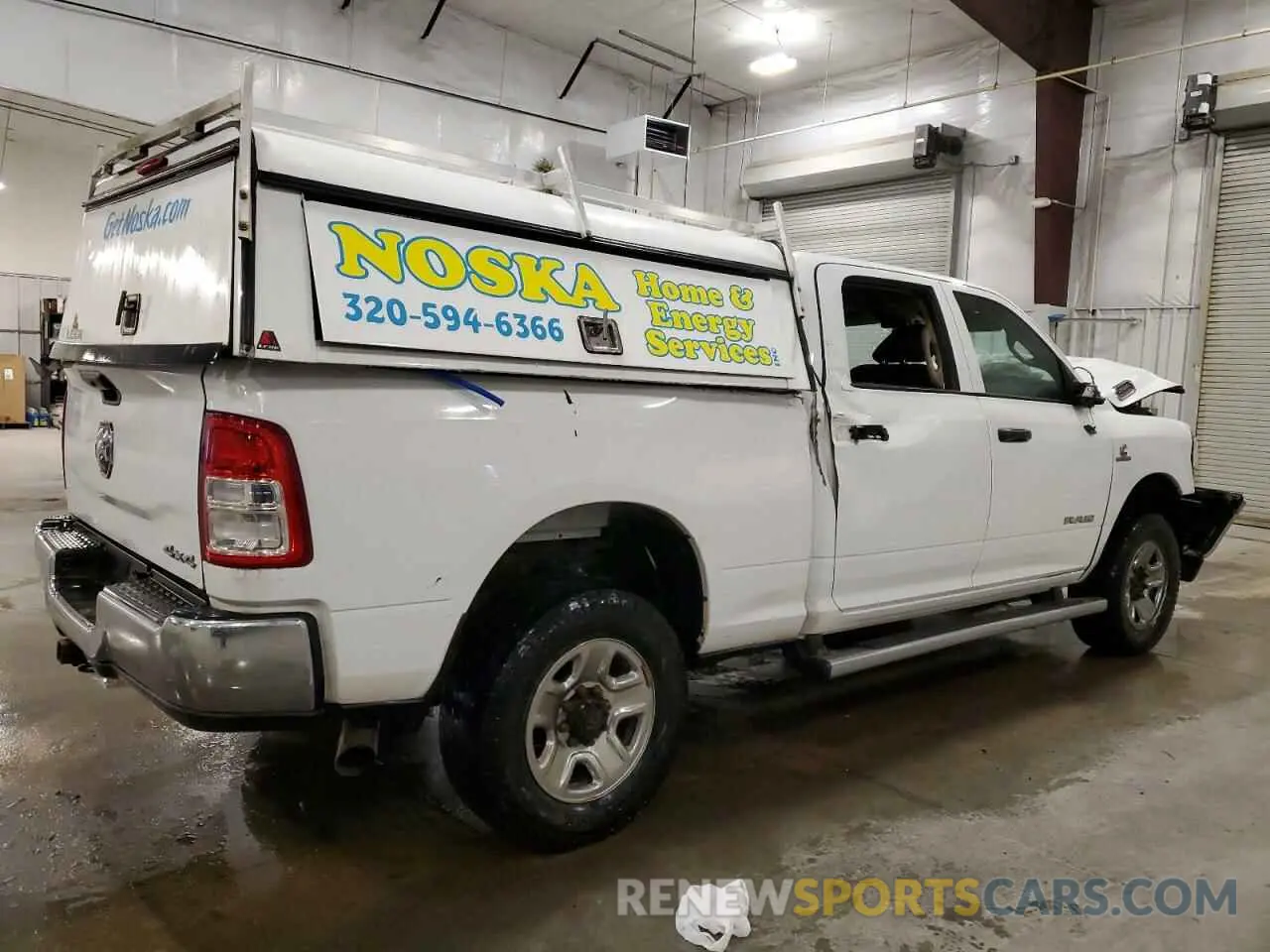 3 Photograph of a damaged car 3C6UR5CL9KG719814 RAM 2500 2019