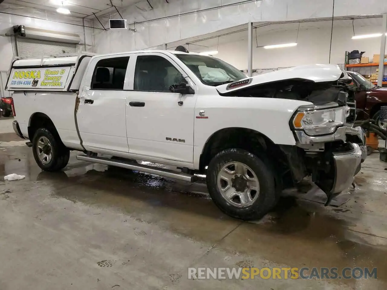 4 Photograph of a damaged car 3C6UR5CL9KG719814 RAM 2500 2019