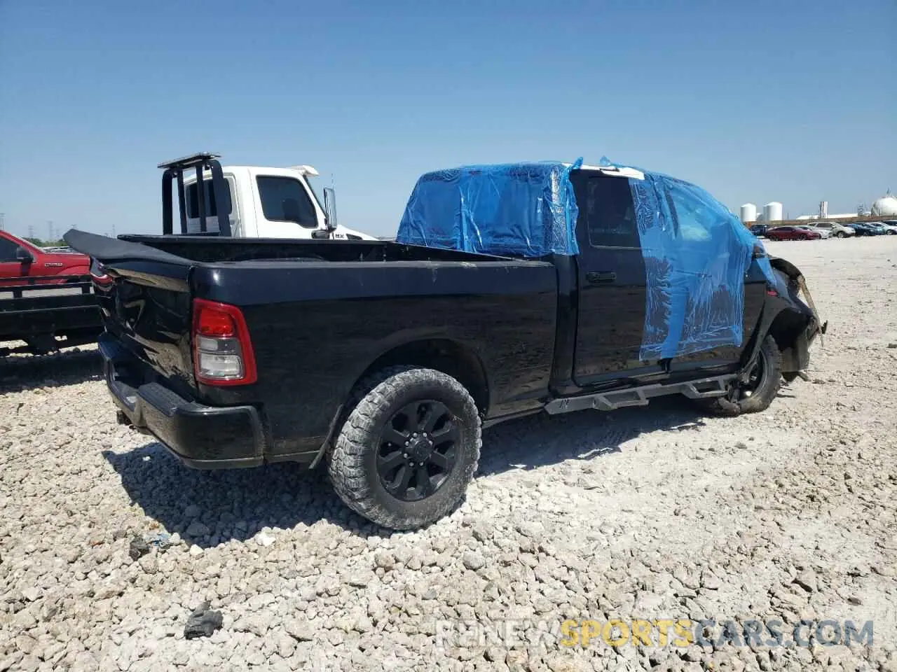 3 Photograph of a damaged car 3C6UR5DL1KG641088 RAM 2500 2019