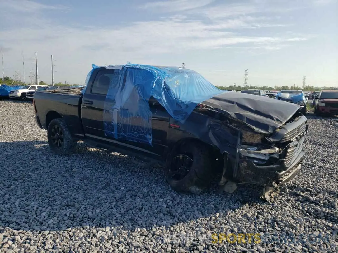 4 Photograph of a damaged car 3C6UR5DL1KG641088 RAM 2500 2019