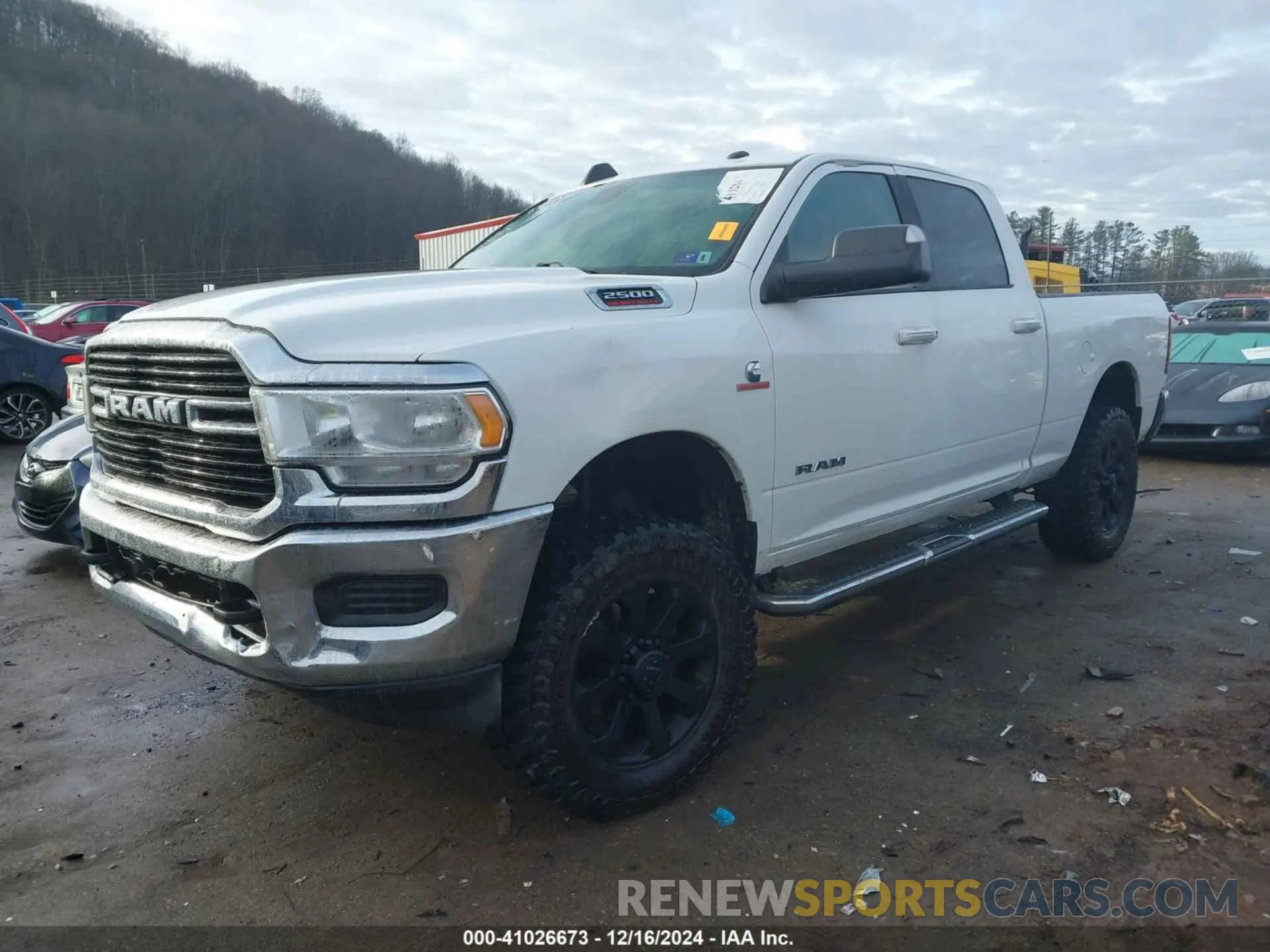 2 Photograph of a damaged car 3C6UR5DL2KG544594 RAM 2500 2019