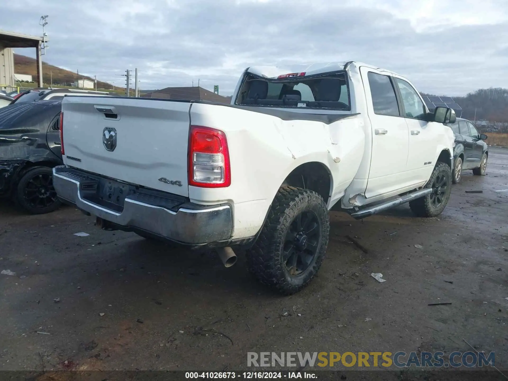 4 Photograph of a damaged car 3C6UR5DL2KG544594 RAM 2500 2019