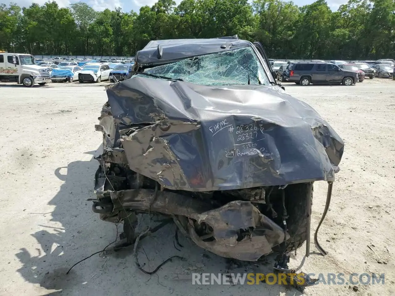 5 Photograph of a damaged car 3C6UR5DL3KG559671 RAM 2500 2019