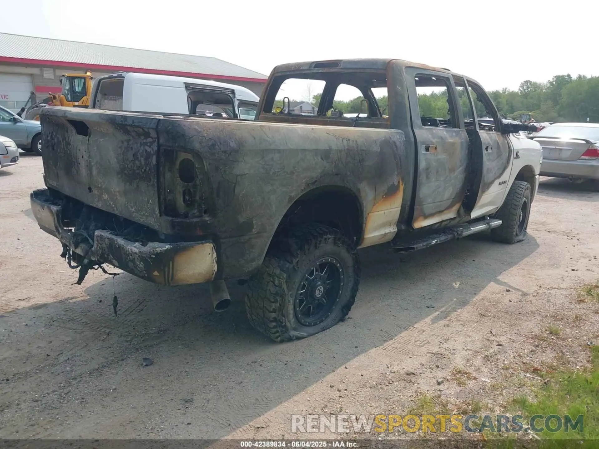 4 Photograph of a damaged car 3C6UR5DL3KG714509 RAM 2500 2019