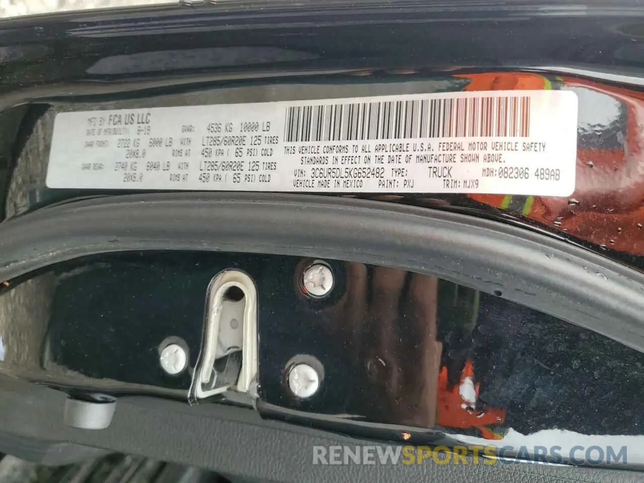 12 Photograph of a damaged car 3C6UR5DL5KG652482 RAM 2500 2019