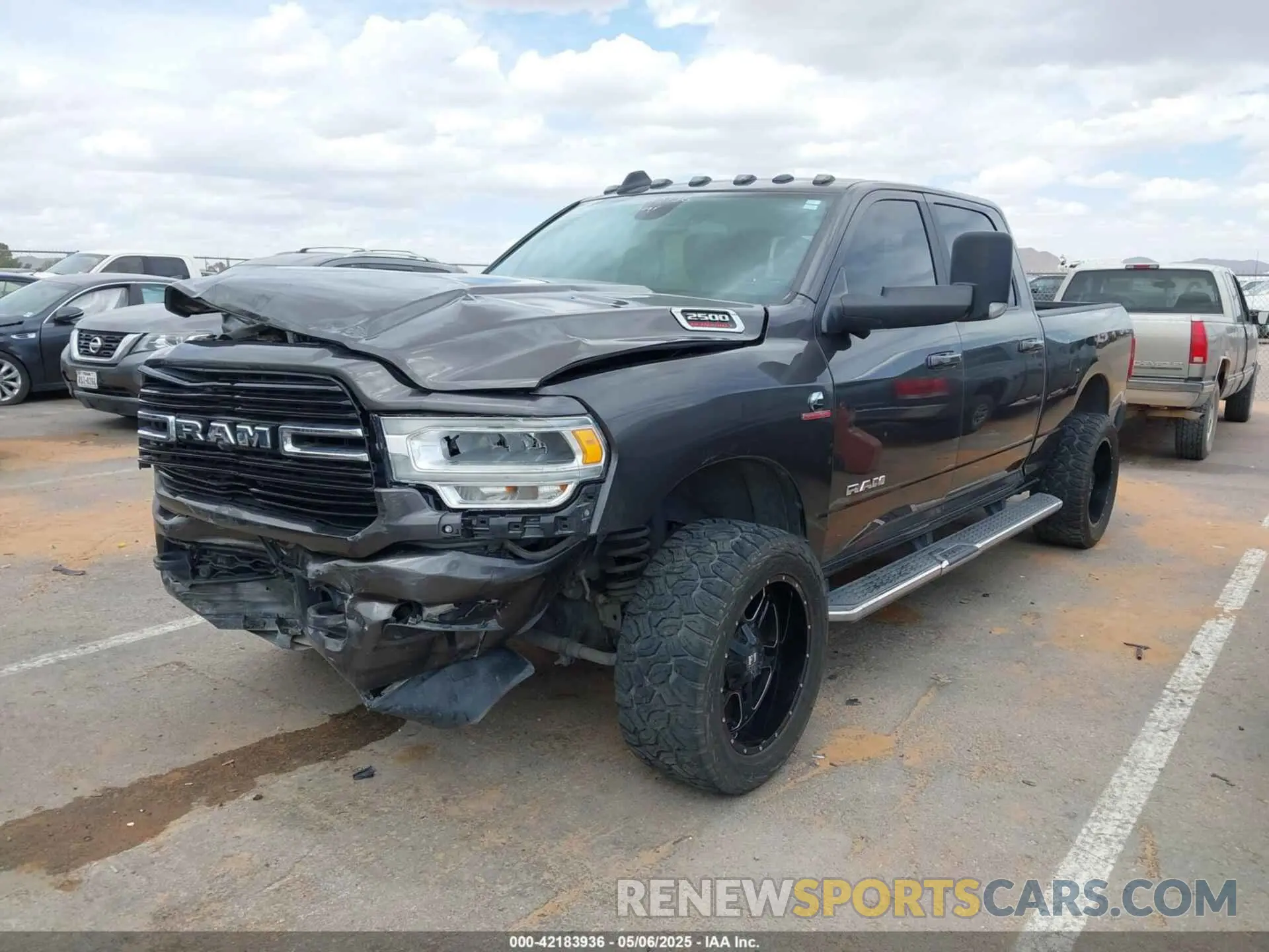 2 Photograph of a damaged car 3C6UR5DL9KG604368 RAM 2500 2019