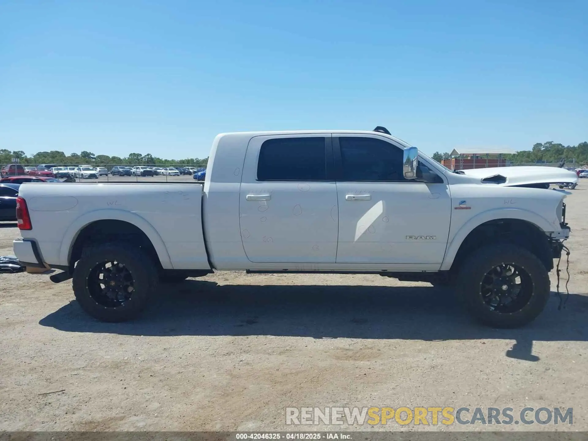 14 Photograph of a damaged car 3C6UR5NL2KG718789 RAM 2500 2019