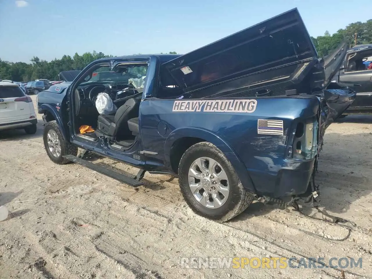 2 Photograph of a damaged car 3C6UR5SL6KG718850 RAM 2500 2019