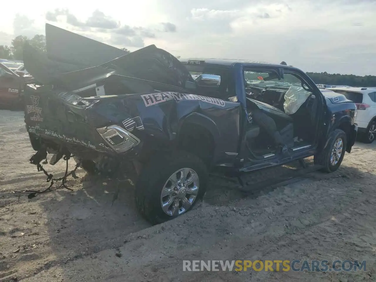 3 Photograph of a damaged car 3C6UR5SL6KG718850 RAM 2500 2019