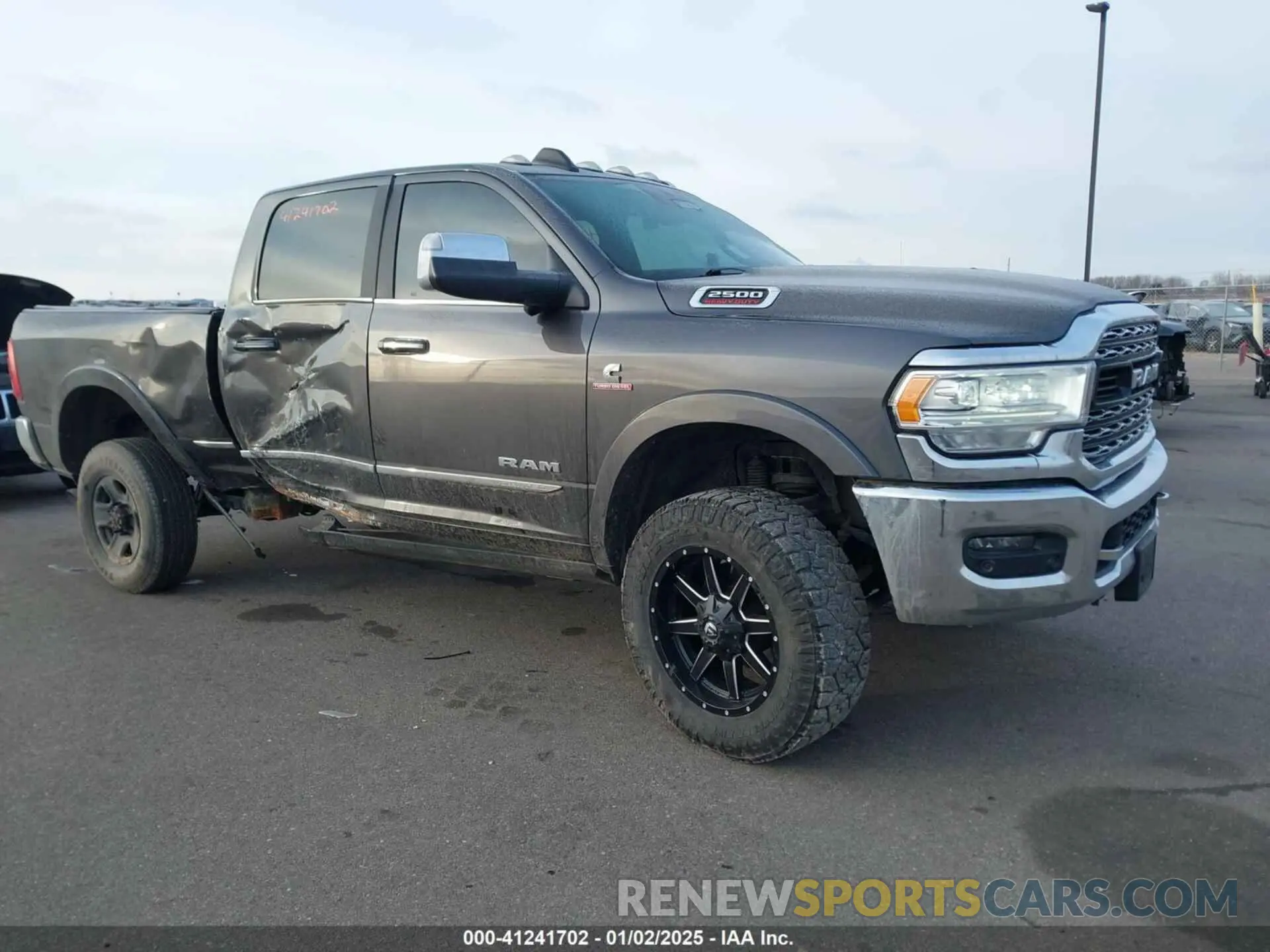 1 Photograph of a damaged car 3C6UR5SL8KG516995 RAM 2500 2019